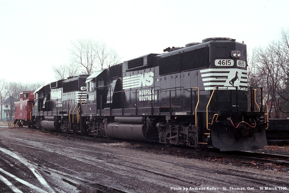 Norfolk Southern GP59's 4615, and 4618, plus an N&W wide vision caboose await their next assignment in St. Thomas on March 16th, 1990