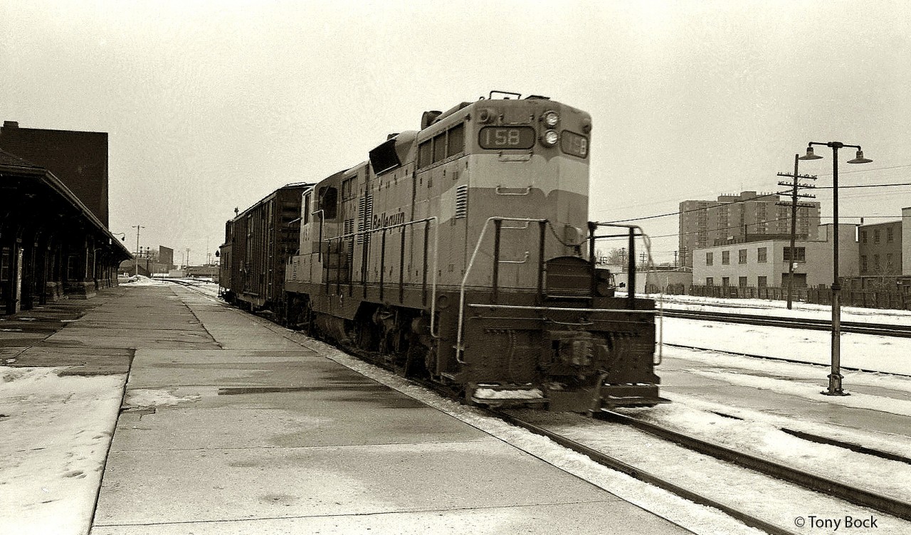 On a rather unpleasant day in February 1972, Bellequip 158 pulls a short train through West Toronto Station heading downtown.  Bellequip 158 was an ex-QNS&L GP9, owned by this short lived locomotive leasing company.
