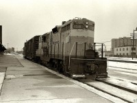 On a rather unpleasant day in February 1972, Bellequip 158 pulls a short train through West Toronto Station heading downtown.  Bellequip 158 was an ex-QNS&L GP9, owned by this short lived locomotive leasing company.