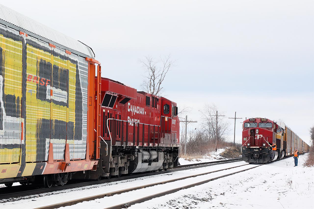 An act as old as railroading itself …the roll by inspection. 147 waits for 2-240 at Orr's Lake (just above Cambridge) and the waiting crew gets off to give the other train a running gear, dragging equipment, anything out of the ordinary look over, a tradition that goes back to day1.