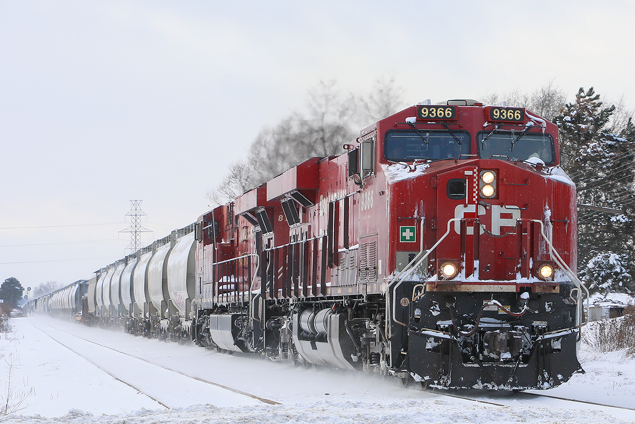 Along with 8718 ( the new twins of 254 for a coupe of weeks), 254 approaches the descent into the Grand River Valley showing some of its snowy adventures since London, but with not quite enough "ummppphhh" to really kick up more.