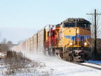 This isn't Iowa. Along with CP 6248, the light snow spins off the not terribly common foreign leader in Ontario. 244 accelerates out of Galt destined for Toronto on a fabulous winter morning.