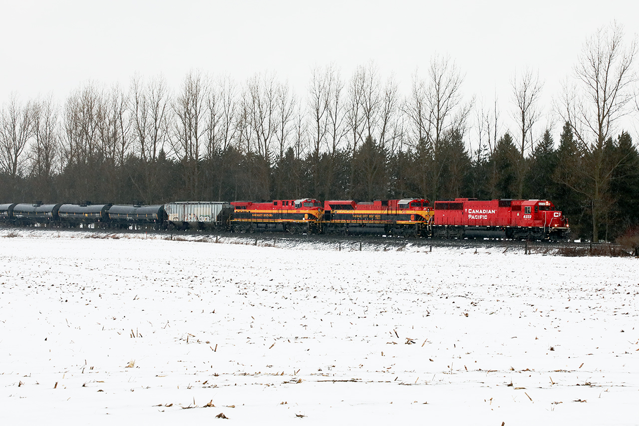I suspect this will be one of the "highlight trains" in Southern Ontario this year. To help out, Mother Nature offered a monsoon just to add some "atmosphere"...large amounts of which fell from the sky. 

But here we have 650, in a downpour approaching Blandford Siding with 6232 followed by KCS 4132 and 4584; units that would have looked fabulous in even a muted sun.