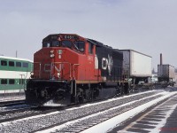 A very short, one spine car 3-pack #154 cruises through Georgetown. I believe this was the ill-fated Buffalo intermodal train that connected with CSX. 