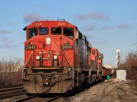 CN L570 with 2441 in the lead passes through Goreway Avenue with a ES44AC and a C44-9 trailing facing rear