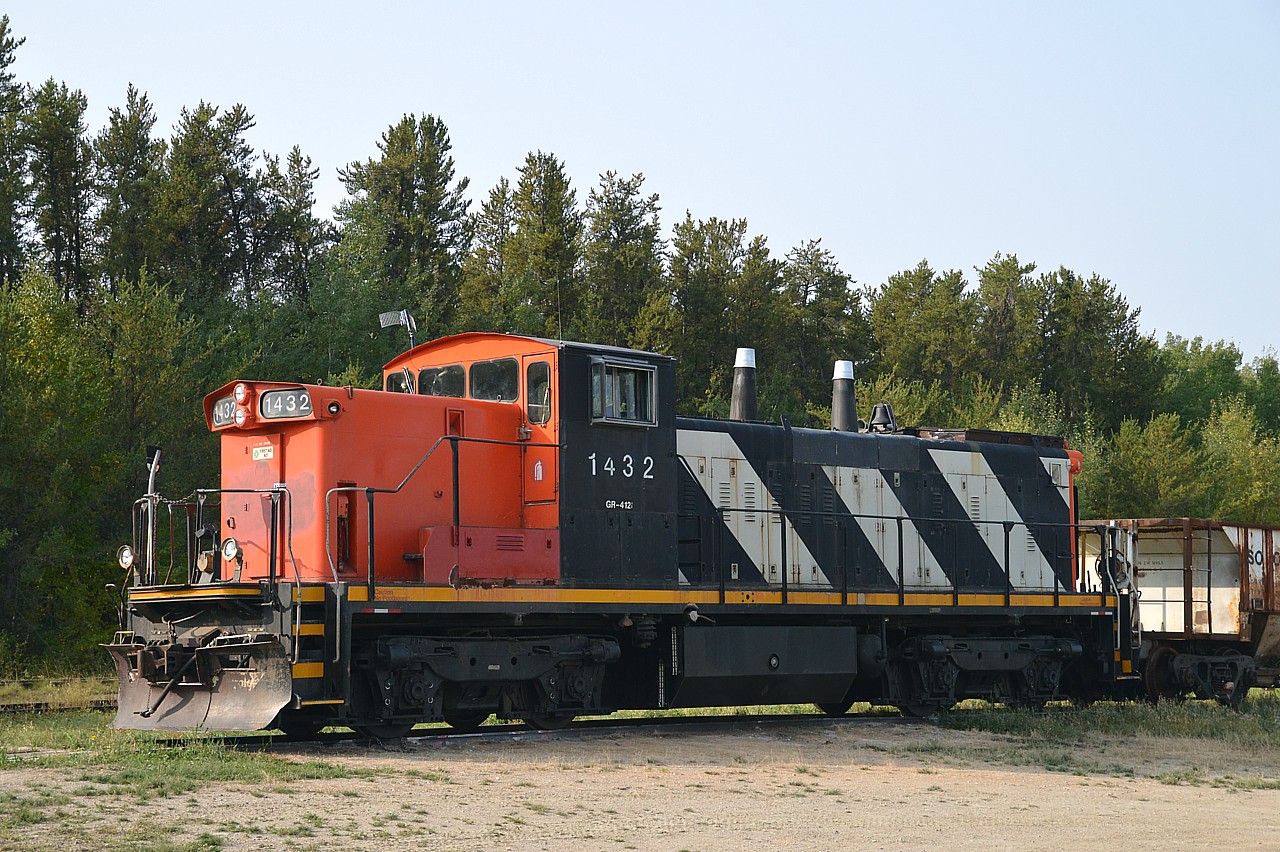 I was rather pleased to find Torch River Rail's GMD-1u sitting at it's headquarters in Choiceland. But, it looks as though the stacks are capped.
Wondering what this is all about, knowing they only have the one unit. Perhaps this road only ships grain and the season is done?  Just curious.
Of the photos I shot of this unit, I liked this one best, although against the weak sun of the day. This locomotive came from CN at the startup of the 27 mile TRV in 2008.