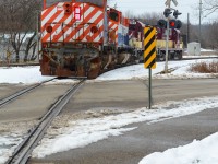 Having just shot the St Thomas Job down in Tillsonburg, I noticed going by Salford that the remaining ex BC Rail M420W’s have been removed off one of the deadlines out of sight and that the Woodstock Job had just left for it’s days work. Quick drive up to Ingersoll hoping I haven’t missed them as I didn’t know how close they were — not 30 seconds getting out of the car, 182’s horn started to blow for the crossing behind me with the 181, CFS 641, and 646 in trail. Quickly turning around after they cleared the road brings a shot that looks like they’re leading down to Salford, but they aren’t. Sold to Sartigan Railway in Quebec along with the other pair of MLW’s that went earlier in the year, it’s clear these units are being used as part sources for the 644 and 647 that are already at their home. Shortly after, they’ll be set off on the west end of Ingersoll Yard for the St Thomas Job to lift for St Thomas where they’ll be transferred to CN 584. Don’t let the bottom of this frame fool you, not sponsored by Heineken. 