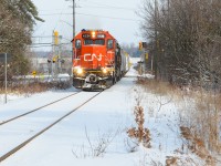 An unusual Sunday brings both of Kitchener’s power sets being separated. 540 took the GMTX set to Guelph leaving 568 with the CN set to make their movement to Stratford and HCL with a D6 from Babcock and Wilcox for Bruce Power near Goderich. A quick heads up that they’re ready to leave Kitchener with the GTW 6226 up front made me quickly run out the door and beat them to a spot I know I wouldn’t miss them at which brings this. The sun is out partially and the ground is snowy giving a perfect photo combo for the GTW 6226 and CN 4028 as they pull over the large intersection at Foundry St and Snyder’s Rd in Baden with a clear signal and the generator on the tail end. It’s decently hard to see anything out of Kitchener that isn’t with a blue GMTX leaser but it could very well happen at any time depending on what’s needed and that’s what peaks my interest. The high headlight on this former DT&I unit was also a neat change to your usual Guelph Sub power.