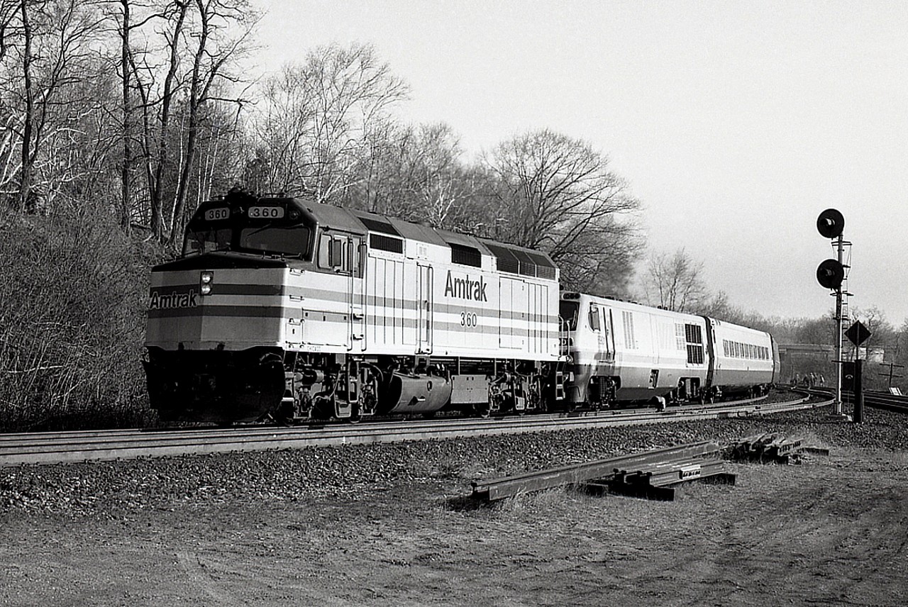 My assumption is that this is the morning International, the AMTK train that passed thru Bayview around 0900 for Chicago from Toronto. But it sure doesn't look like one. Second unit is VIA 6901, an LRC-2. I have accounted for VIA #71 this morning, so this leaves me no other guess. Nice quiet morning, after all it is a Tuesday, and thats the way I liked it. 
Those LRCs were real lemons. Endless problems with them resulted in the whole fleet of 6900-6930 lasting about 20 years. The 6901 pictured was built 1980 (as was the AMTK) retired 2001 and sold to Industrial Rail Services in 2003. 
Photo shot using B/W 400 ISO medium format (2x3 inch negs) film in a graflex roll film holder in back of a 4x5 Speed Graphic. All that fumbling around when today one can just grab the digital and shoot!!