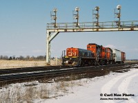 What is assumed to be CN train 585, is viewed departing westbound at Paris West on the CN Dundas Subdivision with CN slug 260 leading GP9RM’s 7265, 4107 and two cars. At the time, this local operated from London as far east as Paris and Brantford, usually making an appearance in the afternoon. CN 260 was classed as an HBU-4, which was a hump booster unit. It wasn’t common practice for a slug set to be assigned to this turn, however it was the 90’s so anything was possible even on local jobs. 
