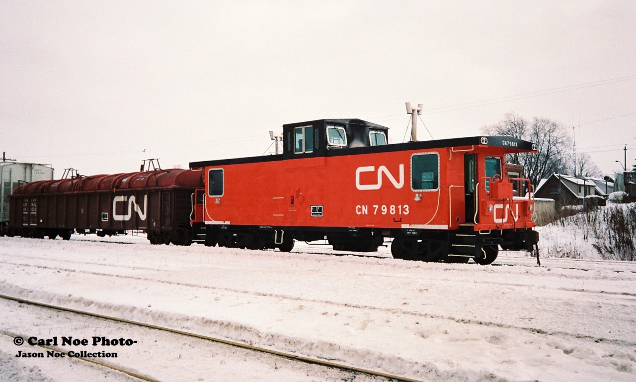 A very nice looking CN 79813 brings-up the rear of CN 422 seen at the Kitchener yard on the Guelph Subdivision. My notes show the train powered by 9485, 9627, 4126, 5361 and 4117.