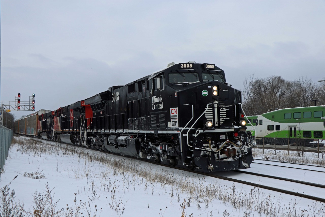 25 minutes behind 382 with the CN Vetrans unit, the prize of the day came along--IC heritage unit 3008 leading train 384! (I always thought that a GE in IC black would look good...especially against snow.)