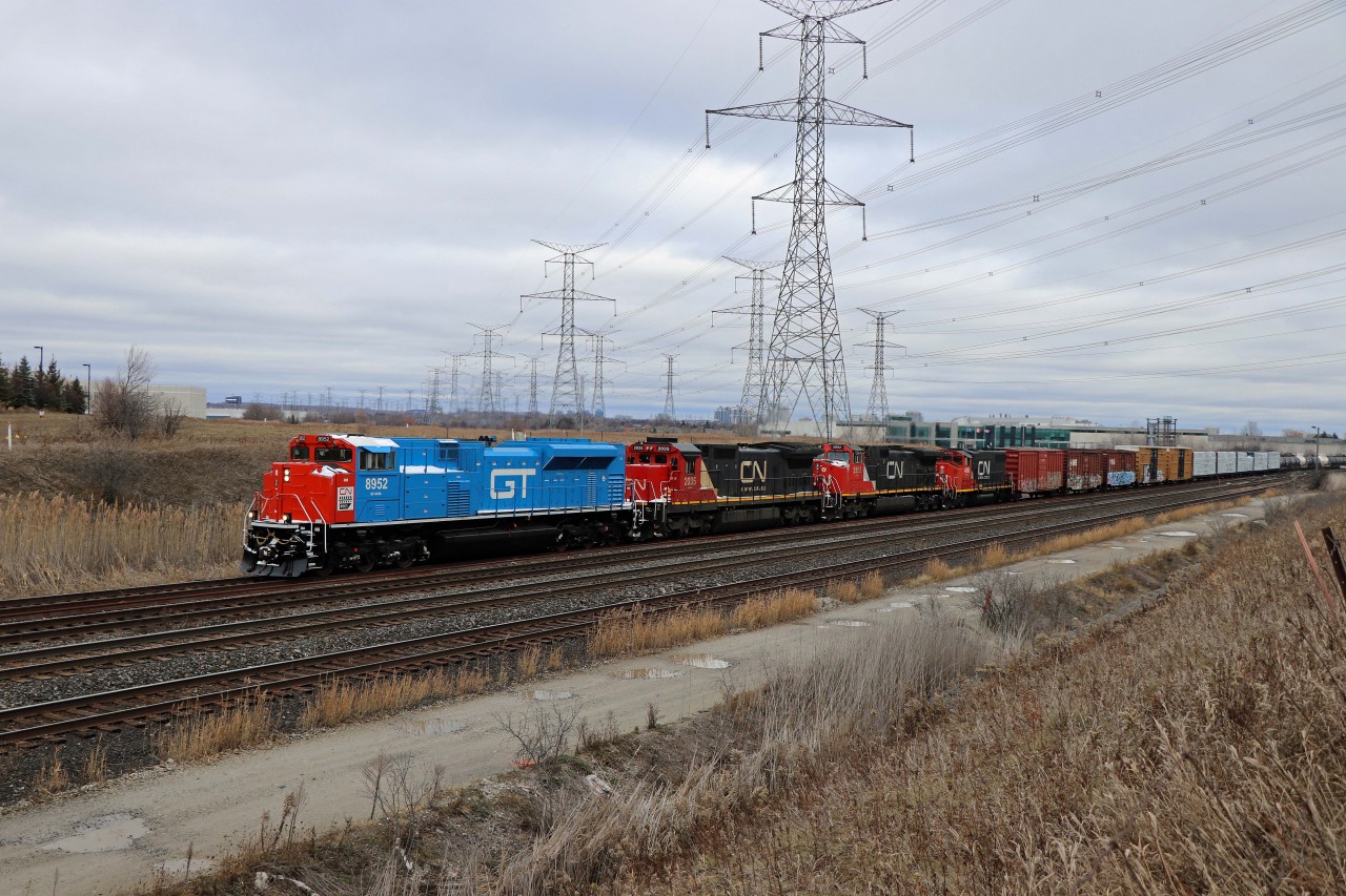 Having received a "heads up" that the GTW Heritage unit would be leading into Toronto, I headed out to Snider (the entrance to MacMillan Yard) on Sunday morning. Patience was rewarded when train 450 from North Bay finally pulled into the yard around 1235 (after being held out due to congestion). Power was SD70M-2 8952, C40-8 2035, C44-9W 2552, and GP38-2W 4790 (probably returning from Huntsville).