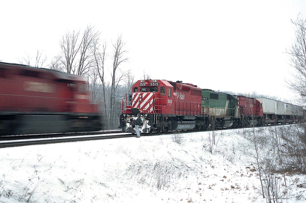 Back when I was a working stiff; I realized early in my suffering that I only worked to pay for film and to go out no matter what. Well, those days have certainly changed. :o)
Here we are in the deep dark days of January's damp cold, and I am already up at Guelph Jct (from home in St. Catharines) and it is not even light enough to shoot a moving train without blurring. In film days it was a lot different than with todays' digital. In this image, I am shooting 30th of s sec with camera on a tripod, as I was really lucky to catch this train stopped. It was waiting for an eastbound at 1st Line.
Just like the moaning I hear about even today; trains run mostly thru the night. And so it was in 1992 at the Junction. You had to hope a few were late.
CP 5515, GO 723 and CP 4717 power this train, a nice combination. Was the GO 'borrowed'?? I dunno, this was a Wednesday.
Any information on that eastbound was not recorded. Image 30/2.8 medium format Kodak 400 ISO, Mamiya 645 1000s.