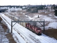 Nippy winter day, but great to be out.  Having just emerged from under the Welland Canal, this short eastbound CP 5529, 5507, 5609 and 5566. Three SD40s and the last is an SD40-2. All are off the roster. The SD40-2 was the last to go, retired in 2006. Image shot using Kodak 400 medium format film, Mamiya 645 camera, and I am just off to the south side of the Hwy 140 bridge.