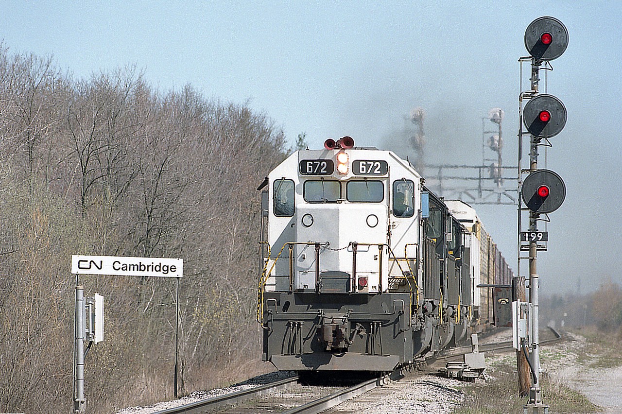 CN Cambridge is about a mile and a half, I'm guessing, south of Port Robinson. Auto parts train NS #328 from Talbotville to Buffalo is on it's way Stateside having just cleared Port Rob. Very unusual to see a former Kansas City Southern leading this train; but then NS #327-328 was full of surprises. This was just another one to enjoy.
Power is CP 672, NS 3273 and 6673. The 672 later became CP 5417.