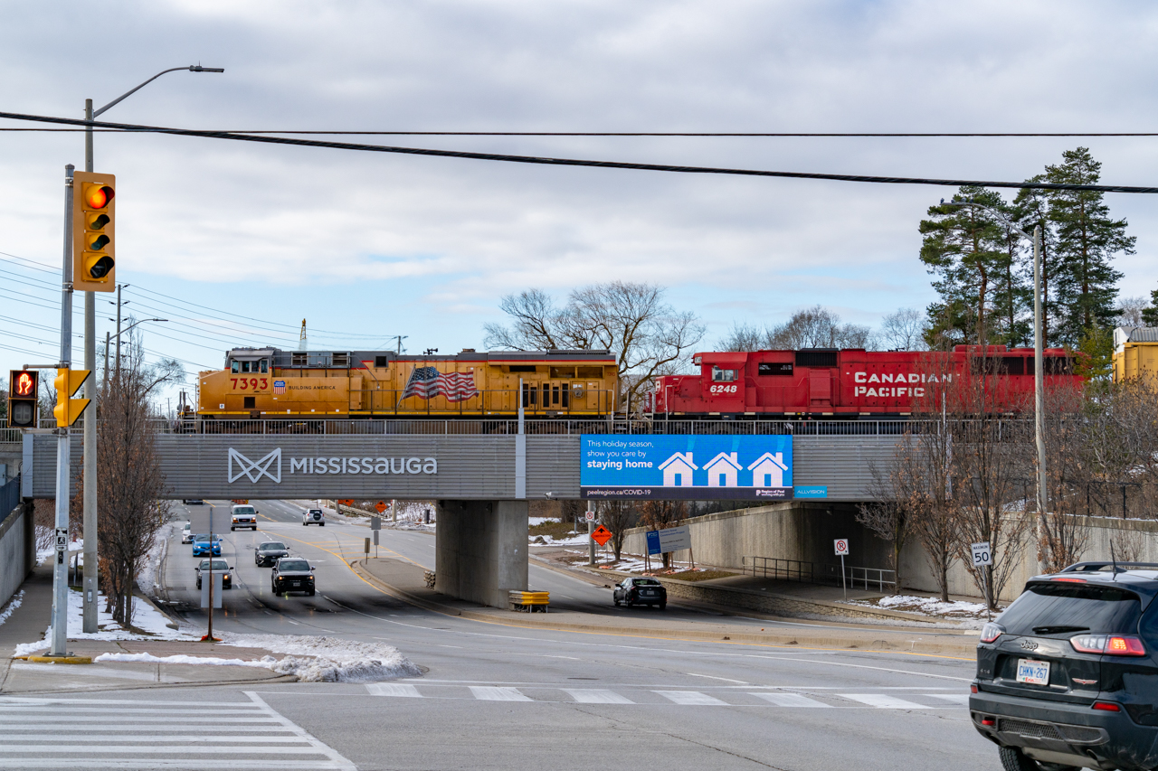 Because of slow moving vehicles, I wasn't able to get where I wanted to be to catch this train. I figured I would take a guess and see what I could get, given I'd miss the train if I tried going where I wanted to. As it turns out, luck was on my side. UP 7393 certainly didn't stay home this holiday season.