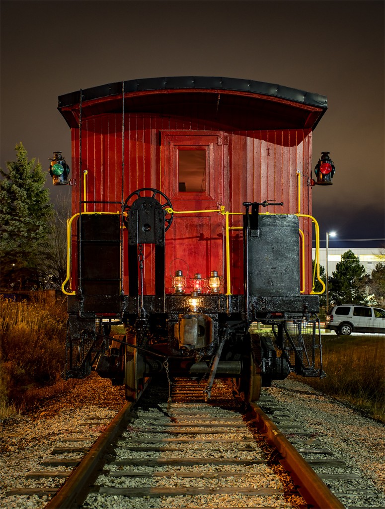A Merry Christmas and best wishes from the Guelph Historical Railway Association!
With marker lamps lit and a collection of lanterns shining, caboose 436994 poses for a night time shot. Lanterns include a 1947 Ontario Northland Railway, a 1925/30 Canadian National Railway, and two 1910 era Grand Trunk Railway lanterns. 
436994 was built around 1928, and served until the 1980s. The caboose also served on the Dominion Atlantic Railway in the 1970s. It was given as a thank you gift to an executive of a large retail firm here in Canada, as a thank you for signing a large contract with the CPR. It was moved to a property near Mildmay, Ontario. It was acquired by the GHRA from there, and moved to Guelph where it has been restored and maintained ever since.
Our group also acquired caboose 4900 through a donation by the Ontario Southland Railway in August of 2020.
