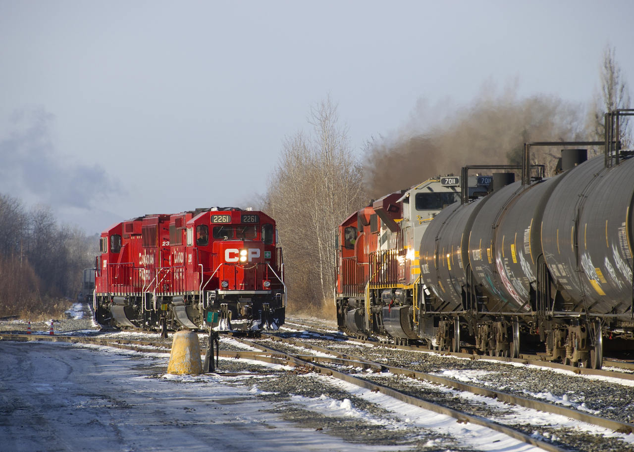 CP 251 with CP 6018 & CP 7011 starts to leave Sherbrooke as it slowly passes CP F20 with CP 2261 & CP 2307 for power.