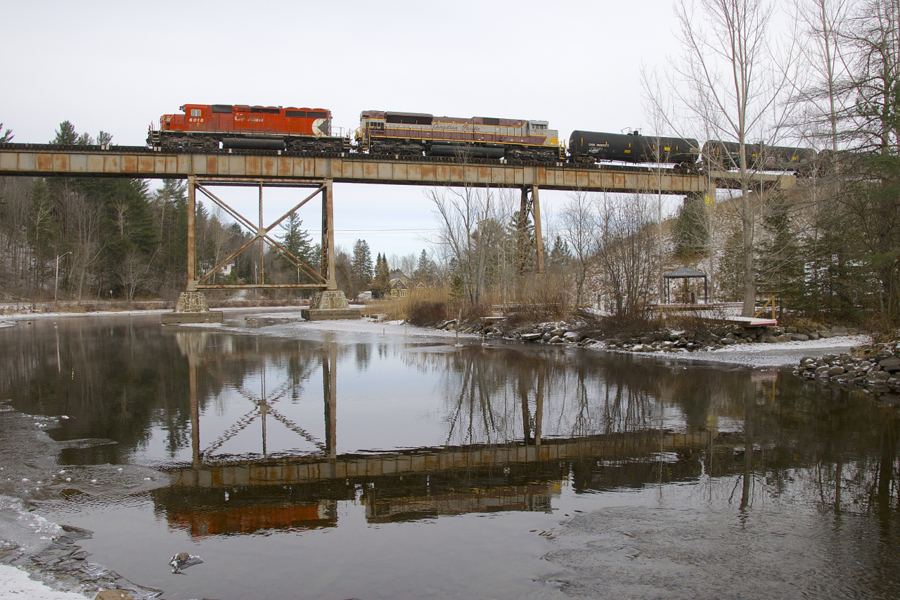 After having shot MMA, CMQ and Orford Express trains at this well known location, its still somewhat of a shock to me to be shooting a CP train with CP power here. Here we see CP 251 crossing the Eastman trestle, with EMD power CP 6018 & CP 7011 reflected in the still water.