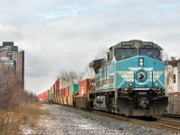 <b> A Repeat of Sorts </b>
<br>
<br>
In August, CEFX 1002 made its first appearance on the North Toronto Sub (in the CMQ scheme) nose-out DPU on 113 (<a href="http://www.railpictures.ca/?attachment_id=42467"> http://www.railpictures.ca/?attachment_id=42467 <a/>). Today, 1002's twin; CEFX 1006 appeared in the exact same position on the exact same train and is seen here pushing hard on the rear of the daily Montreal-Vancouver stack train as they clear Bartlett Avenue at mile 4.6 of the North Toronto Sub.