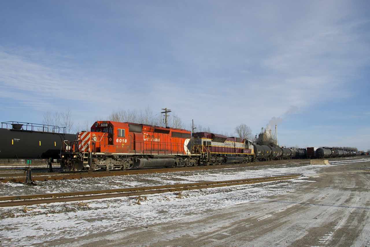 CP 6018 & CP 7011 is the power on CP 251 as it sets off cars in Farnham Yard.
