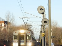 This Thursday, December 31st will be the end of the line for the electric Deux-Montagnes line. Already truncated so that trains terminate at Bois-Franc Station since this past spring (instead of going all the way to downtown Montreal via the Mount Royal tunnel), the rest of the line will be shut down and all the tracks and infrastructure torn up. It will be replaced by the controversial REM light rail project, which is only set to be in service here during Q4 2024. On the third to last day of service, we see EXO 932 approaching Sunnybrooke Station as it crosses the boulevard of the same name. At right is the northbound approach signal for the south end of Roxboro siding, where north and southbound trains meet during rush hours.