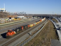 CN 3825 & CN 2932 lead a late CN 149 past the rebuilt Turcot interchange. Most of this area, including CN's current main line here was part of CN's Turcot Yard, which closed in 2002. In the upper far left you can see the McGill University Health Centre, located on what was the site of CP's Glen yard.