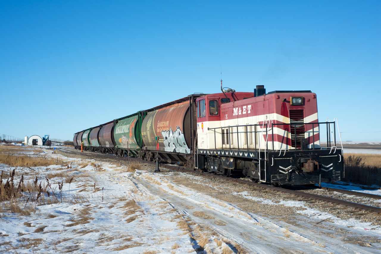 Built 01/1950 for North Louisiana & Gulf, this 70 year old GE 70-Ton still ears it's keep switching grain cars on the Last Mountain Railway at Aylesbury Saskatchewan. These units have a distinct four stroke bark that sounds more like an ALCO than a GE.