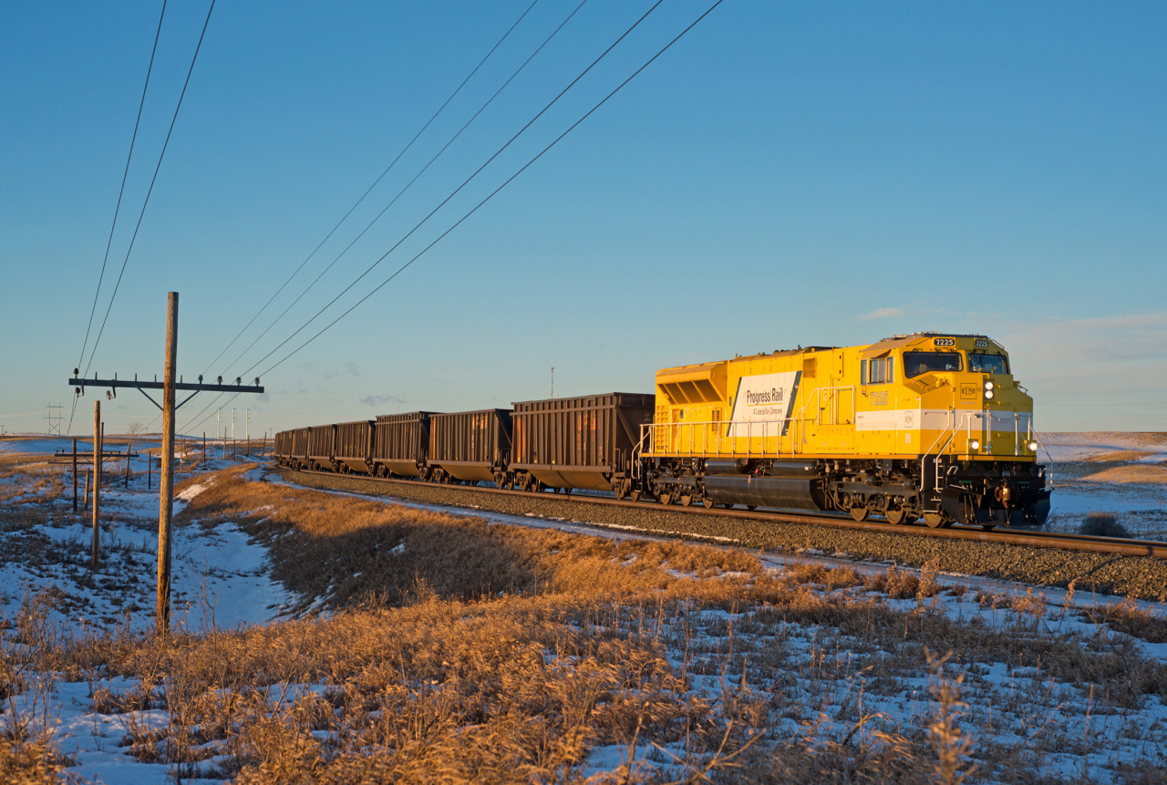 EMDX SD70ACe-T4 #7225 is seen leading CP train 850 through Secretan Saskatchewan in the last light of the day.  60+kmh wind gusts along with normal December temperatures on the prairies made for a very chilly final shot of this chase. These units have often been referred to as "Bananas" by the railfan community, so with that I title this shot.... "Banana In The Freezer".