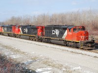 All the excitement over 435 last weekend with the three CN North America painted units got me thinking of other times when I've seen solid consists of "CNNA" units.  I recall an early 90's consist with a GP40-2L(W) and two SD40us at Bayview, and a pair of C44-9W on 148 at Brantford.  I'm sure there were others.  This consist in Fort Erie with three different models in CNNA paint is probably the best example I've got.  The reverse move in the yard with no cars provided a nice opportunity to photograph the consist in favourable light.