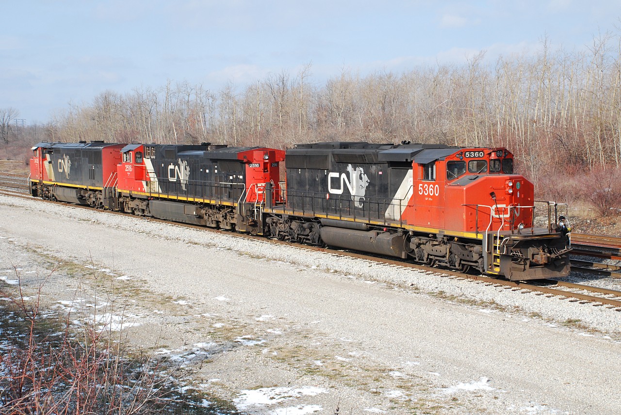All the excitement over 435 last weekend with the three CN North America painted units got me thinking of other times when I've seen solid consists of "CNNA" units.  I recall an early 90's consist with a GP40-2L(W) and two SD40us at Bayview, and a pair of C44-9W on 148 at Brantford.  I'm sure there were others.  This consist in Fort Erie with three different models in CNNA paint is probably the best example I've got.  The reverse move in the yard with no cars provided a nice opportunity to photograph the consist in favourable light.