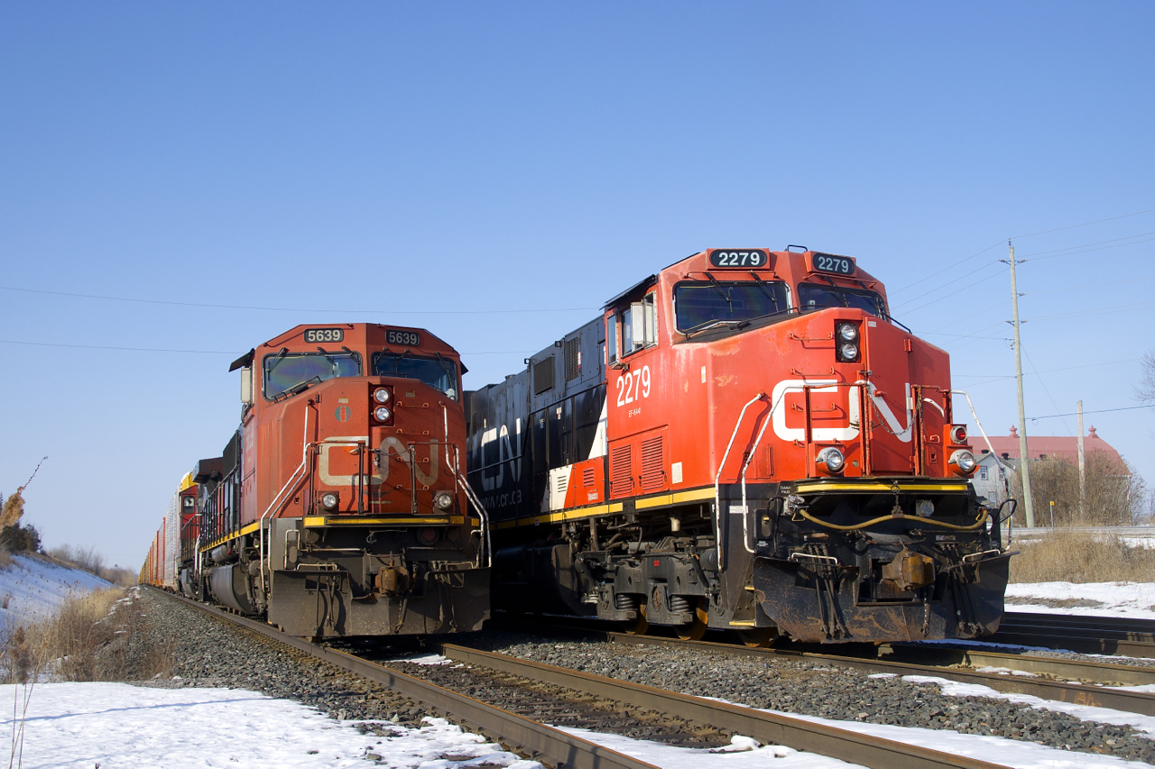 A pair of trains sit parked in Belleville, with a third out of sight at right. At this point in time no trains had passed through here for a couple of weeks due to a protest on CN's main line along Tyendinaga Mohawk territory a bit east of here.