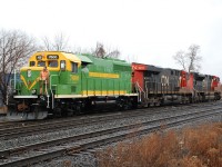 CN 148 has cut off of their train to make a lift at Aldershot.  Leading the reverse move is CN 7600, a new heritage-painted GP40-3 rebuild.  Yes, the green is incorrect but it still looks pretty good.  Maybe it'll look better with some road grime on it.  There's also a matching slug numbered 600, but it must be hitching a ride on another train.  When news broke of these GP40-3s I figured I'd never see one, assuming they would be assigned to major yards far out of view from the public.  So thank you to Joe and others that provided  heads up.  There's also a GP40-3 in Illinois Central black.  I'm interested to see what other paint schemes these GP40-3s come out wearing. 