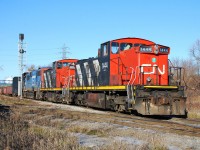 A nice sunny day on Christmas break had many railpictures.ca contributors out to photograph the CN and CP locals in beautiful north-end Hamilton today.  The CN 07:00 job had the triple-set with GMD1us 1444 and 1408, and GTW GP38-2 5849, so that's what I was after this morning.  The "700" is seen about to hit the CP diamond, just west of Gage Avenue North.  The CP local was working Adams Yard already, and radio communication between the two railroads provided us with their game plan for the day.  Too bad CN had foreman working on the N&NW spur.  The 07:00 job was only able to work Parkland Terminal before getting held up from working the CP interchange and switching Stelco.  What seemed like a simple work plan turned in to a long day for the crew.        