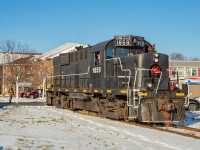 After spotting one load at the Port Colborne Grain Terminal, TRRY 1859 heads back up through town up the Government Spur towards the junction with the Harbour Spur. 