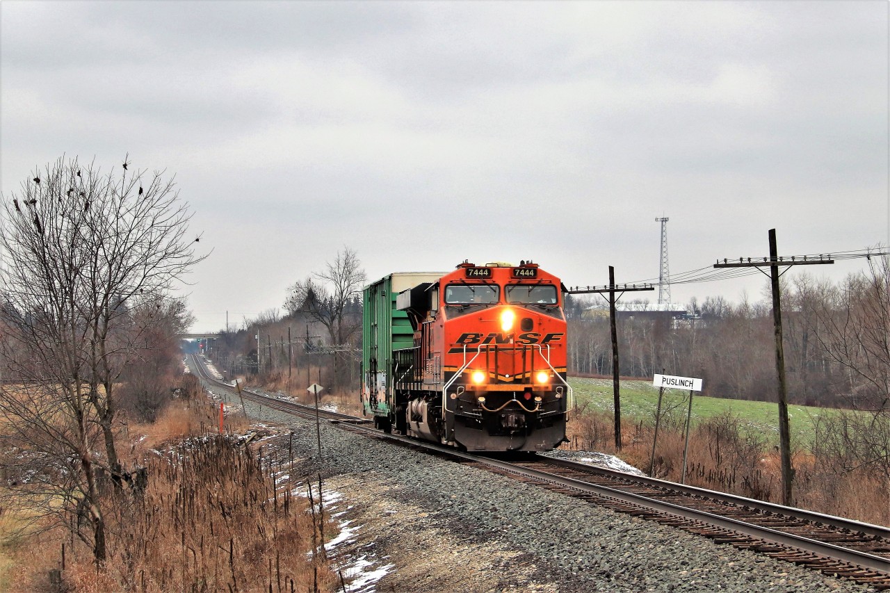 We all knew this was coming and the phone was buzzing for a pumpkin leading through our area. I was rather hoping for a few more cars but I guess one is better than light power. Since it was foreign power, I wanted to get it at a landmark on the Galt sub so the Puslinch name sign seemed a logical spot. Here BNSF 7444 blasts past me on its way eastward for a stop at Hornby.