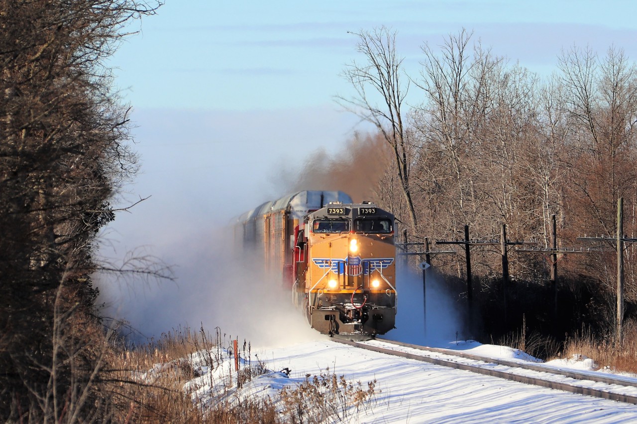 UP 7393 with CP 6248 blast eastward along the Galt sub with 9150 feet of train kicking up the light dusting of snow trackside as they approach the seventh concession.