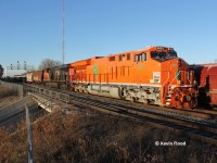 CN 394 finally heads through Aldershot East at King Rd. with heritage EJE unit 3023 and a lengthy train. Time was about 8:35. 