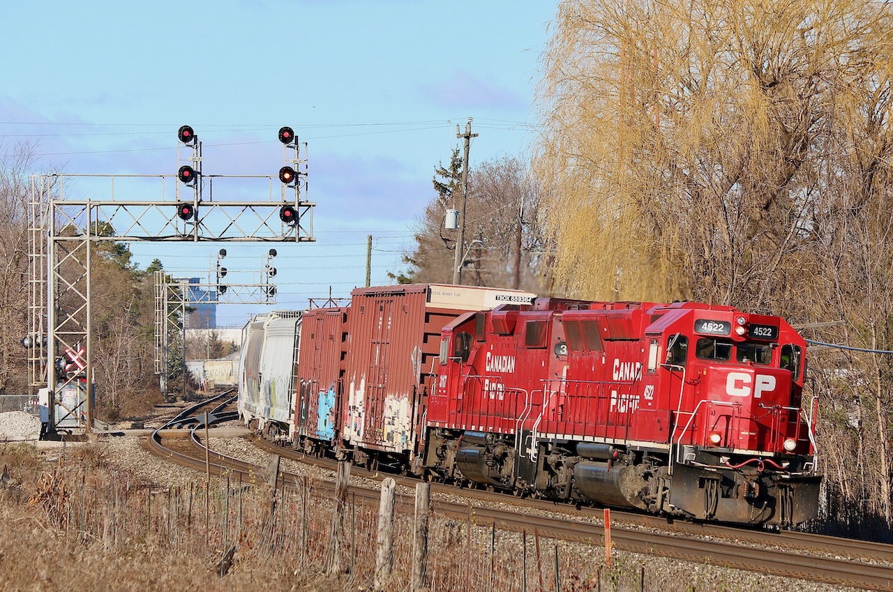 I was hoping former GP40X #4522 would eventually show up on T14 and as luck would have it GP38AC 3004 was pulled off the train over the weekend and replaced by 4522. After grabbing a couple of boxcars from the branch north of highway 401 and working the yard T14 is finally on its way back home to Lambton yard. The 4522 is unique even if it has been rebuilt into a GP38-2 and is technically no longer a true GP40X. CP only has a handful of the former Union Pacific GP40X's and the 4522 is the only one currently assigned to Ontario.