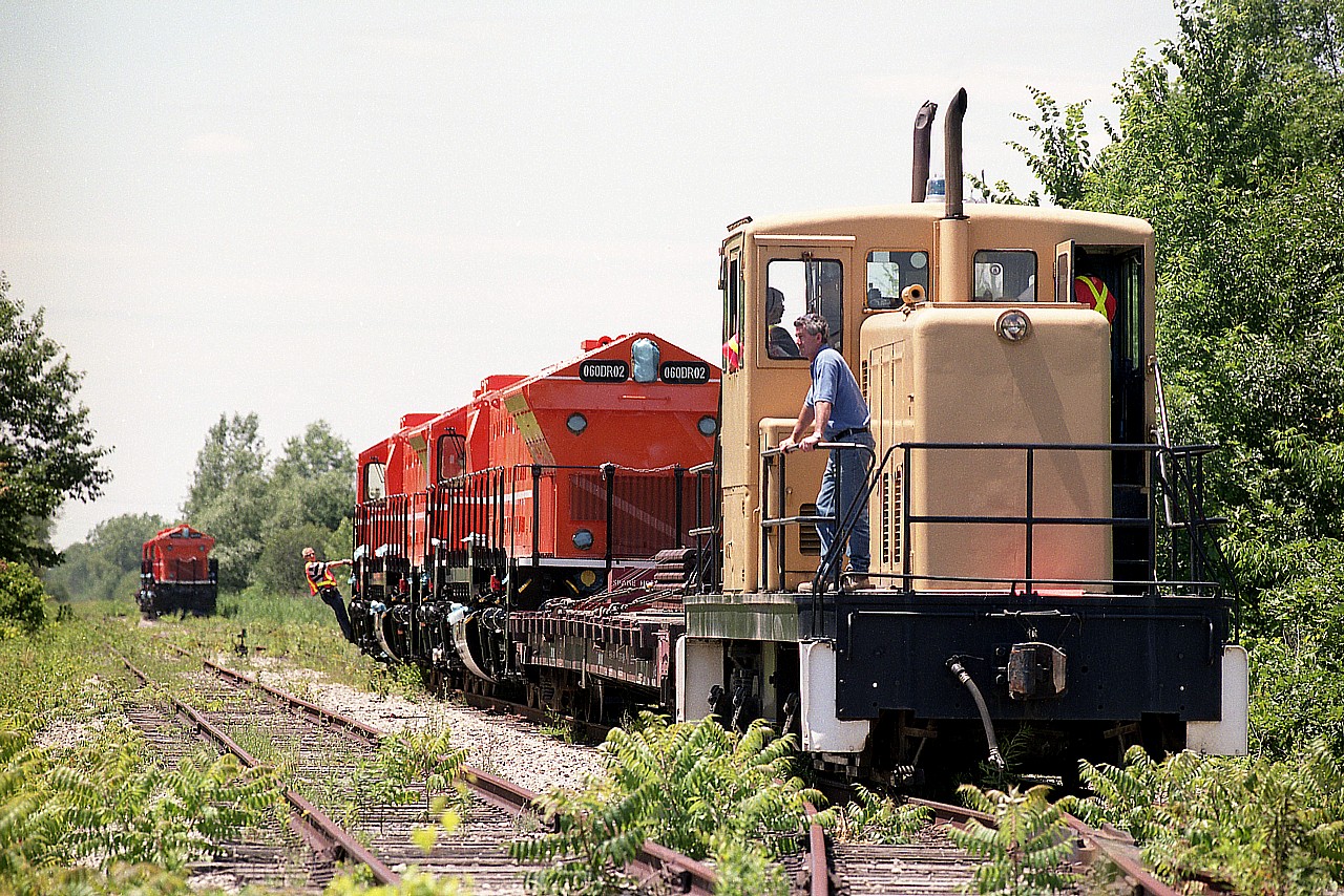 The small plant switcher out of Shaw Pipe prepares to get a group of locomotives finished at ItsRail (now Martech)for CN 7026 and 7025 to take over to CN's Southern Yard. These locomotives are destined for Algeria.