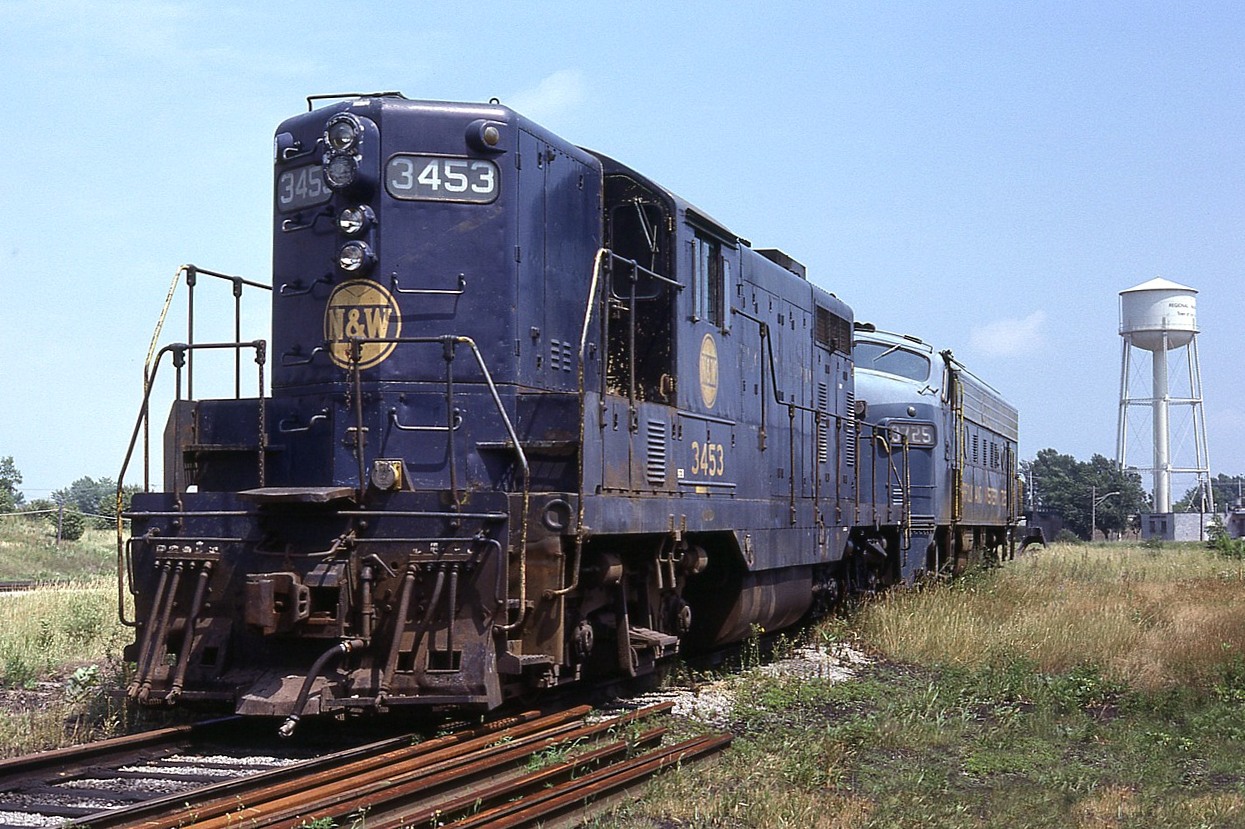 It is pretty well the end of the line for these old N&W warriors sitting near the CN locomotive facility on a warm August day at Fort Erie.  The end of an era.    Seen are N&W GP7 #3453, x-Wabash 453, and I understand built only for service only in Canada. In behind is EMD F7A #3725, originally built back in the early '50s for Wabash as their #1189.
The Niagara Water Tower in the distance is not long from being dismantled. I used to use it as "proof of location" whenever I could.