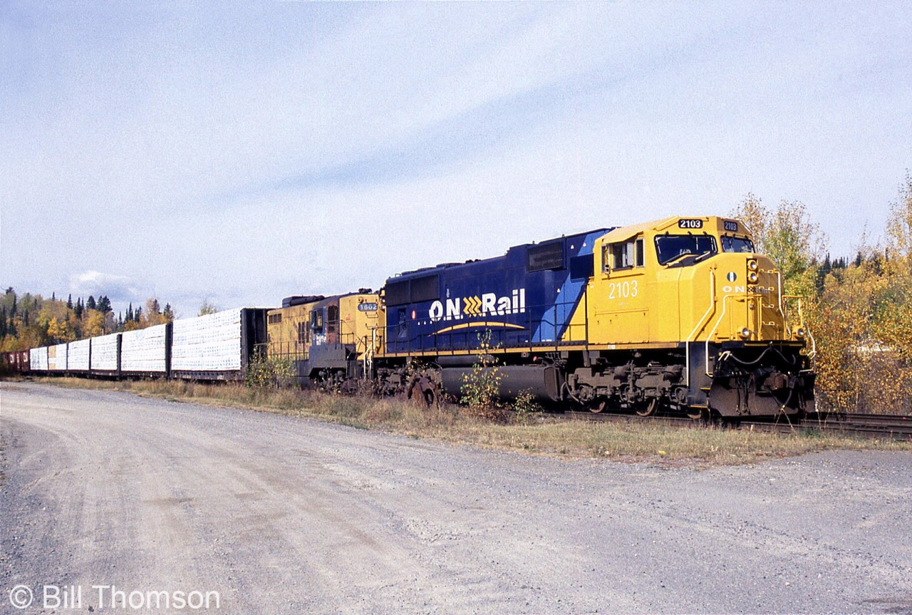 Ontario Northland Railway SD75I 2103 and GP9 1602, ONR's newest power mixed with some of its oldest, are seen leading a train parked at Swastika due to a strike. At the time 2103 was only a year old, while 1602 came out of the same GMD London plant in 1957 and was pushing 42.