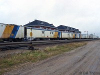 Steam-heated passenger equipment on Ontario Northland's train from Moosonee sits in front of Cochrane Station in September 1993.