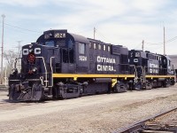 I never much cared for locomotives in solid black paint. (Norfolk Southern comes to mind) However, OCRR 1824 and 1865 look splendid.  No wonder; they are freshly painted.  The fledgling Ottawa Central is less than 6 months old when this photo was taken, and started with a fleet of RS18u diesels cast from the Canadian Pacific. From red to black, same numbers.
It seemed we hardly got to know the Ottawa Central before it was reabsorbed back into the CN after a short lived independence, so to speak, from 1998 to 2008. It had been a wholly owned subsidiary of the Quebec Railway Corporation.