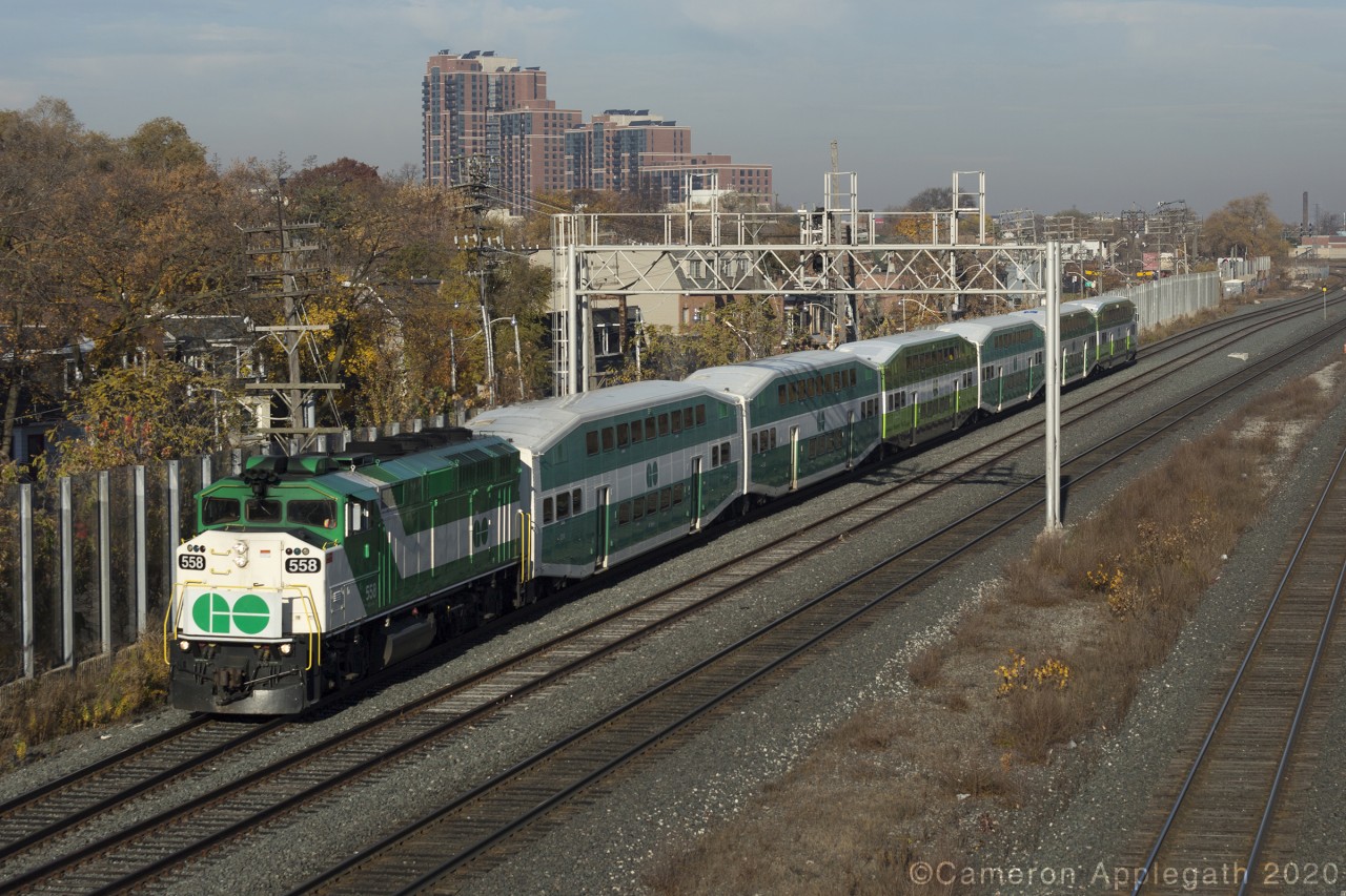 Haven't submitted here in a good while so, here-goes:

I was tipped off the previous evening by a friend of mine as to which of the handful of morning inbound GO trains had an F59PH leading. After grabbing a quick breakfast I walked to Wallace Ave bridge and nabbed GO #2720 lead by GO no.558, with six bi-level coaches on the pin. The train is seen dashing through the Junction neighbourhood of Toronto, about to fly past the platforms at Bloor GO-UPX station.

Due to this seemingly endless COVID nightmare, transport agencies have effectively downsized daily operations as a large swath of the population now works from home. Yet, despite the lighter rush hour density, GO still operates a handful of suburbans between Milton and Toronto, albeit at half capacity per run, which in turn allowed older F59 locomotives to reappear on the Milton line after being phased out by MP40's and twelve car consists back in 2008.