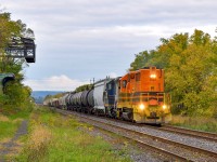 Taking the quick route down the Grimsby Sub, Southern Ontario Railway lugs a long string of cars towards Parkdale where they will pull around the wye into the industrial area.