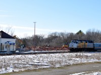 72 rolls past the rubble pile that was formerly the 1886 built Great Western Railway station. Dump trucks were already hauling the station debris away by 11AM