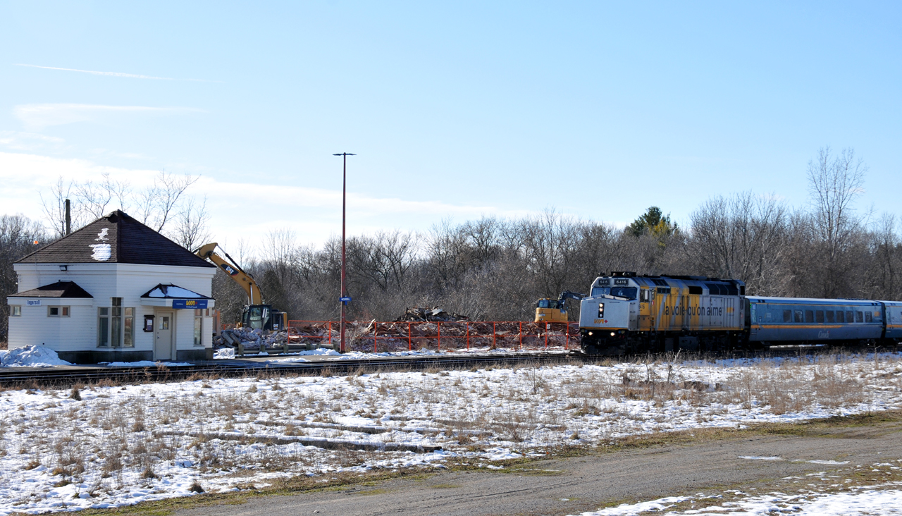 72 rolls past the rubble pile that was formerly the 1886 built Great Western Railway station. Dump trucks were already hauling the station debris away by 11AM