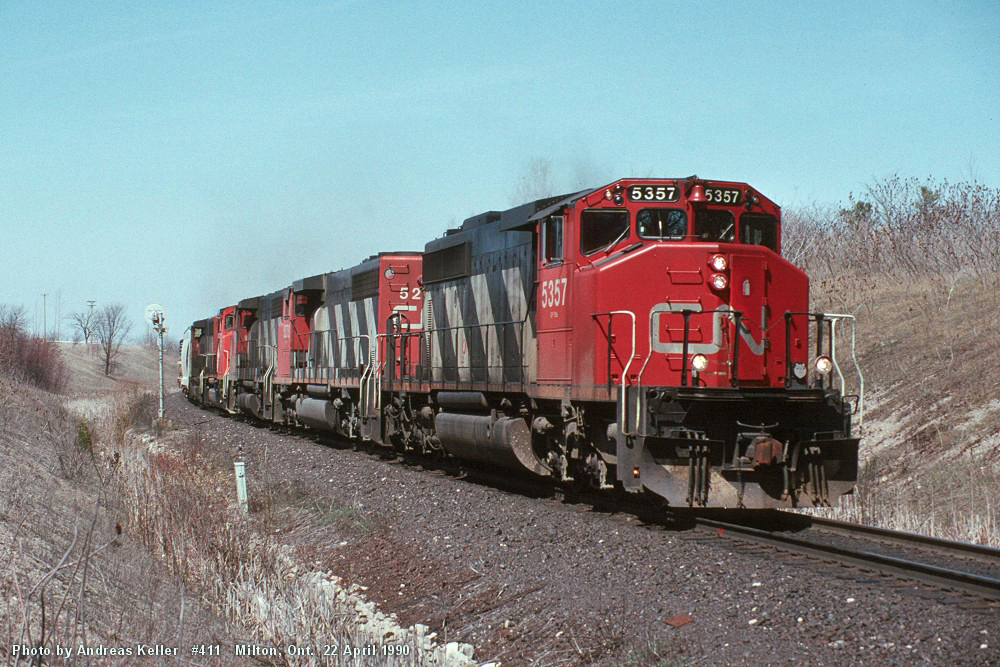 CN SD40-2W 5357 leads four other widecabs through "Mile 30" on Toronto - Sarnia train 411
